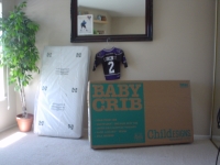 THIS IS THE CRIB WHILE IT WAS STILL IN THE BOX RIGHT AFTER WE CAME HOME FROM WAL-MART